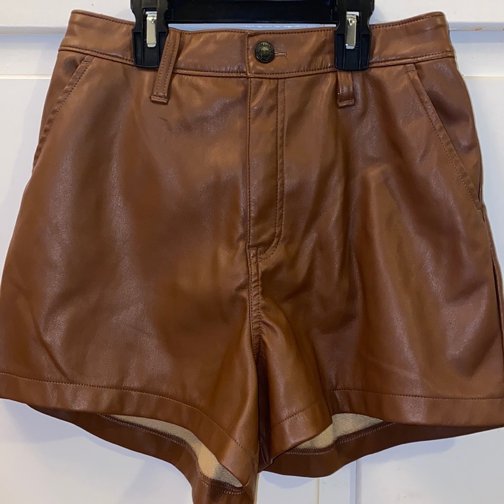 Hollister Ultra high rise vegan leather shorts in brown color with pockets.